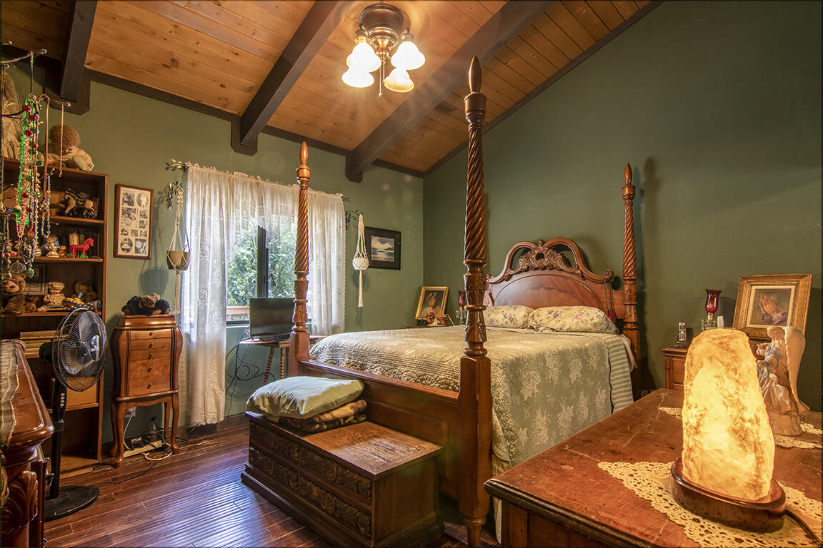 52845 Pine Cove Road Idyllwild, CA 92549 - Photo 9 of 15 a bedroom with furniture and wooden floor