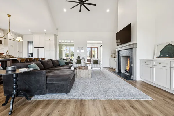 a living room with furniture and a chandelier