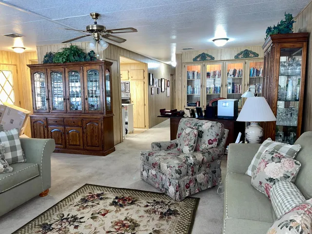 a kitchen with granite countertop cabinets and white appliances