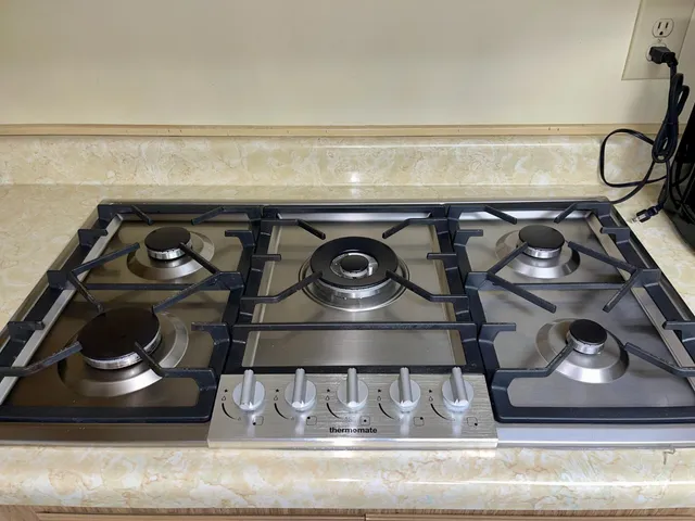 a bedroom with a dresser and a wooden floor
