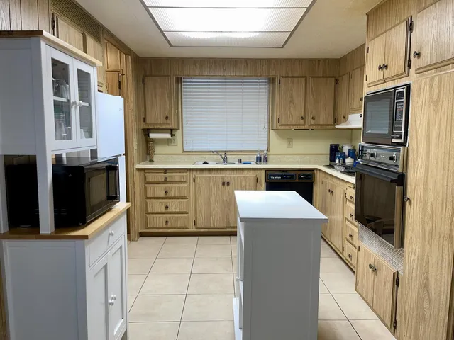 a bathroom with a sink a mirror and a shower