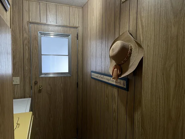 a bedroom with furniture and a window