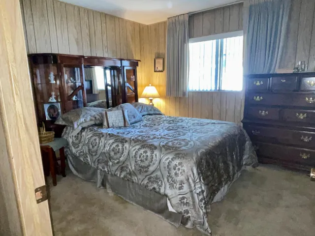 a bathroom with a double vanity sink a toilet and shower