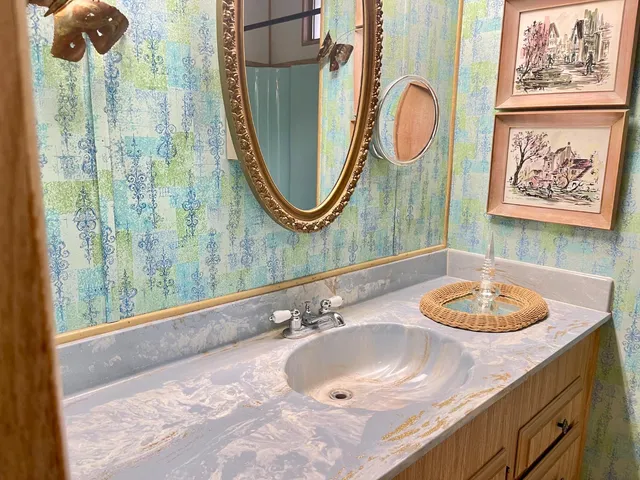 a bathroom with a double vanity sink and a mirror