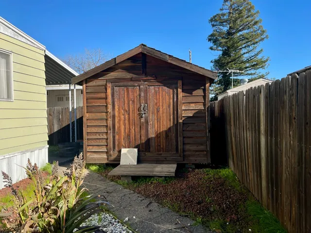 a view of roof deck with a barbeque and potted plants