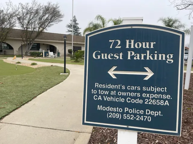 a view of swimming pool with outdoor seating and plants