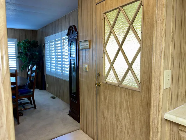a view of a dining room with furniture and window