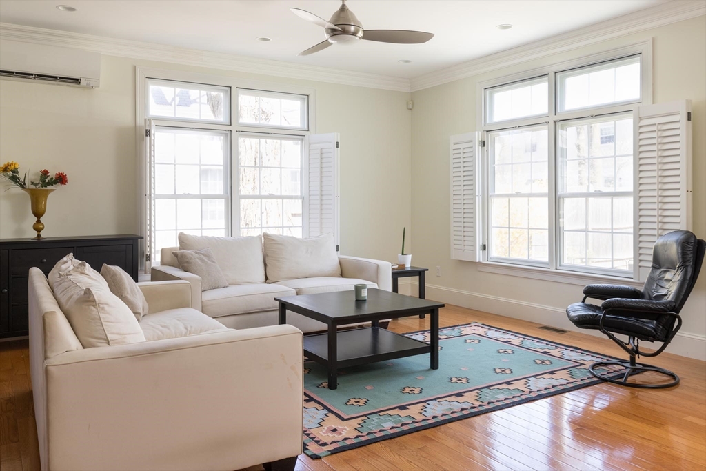 38 Maple Street, Unit 38 Needham, MA 02492 - Photo 2 of 14 a living room with furniture and windows