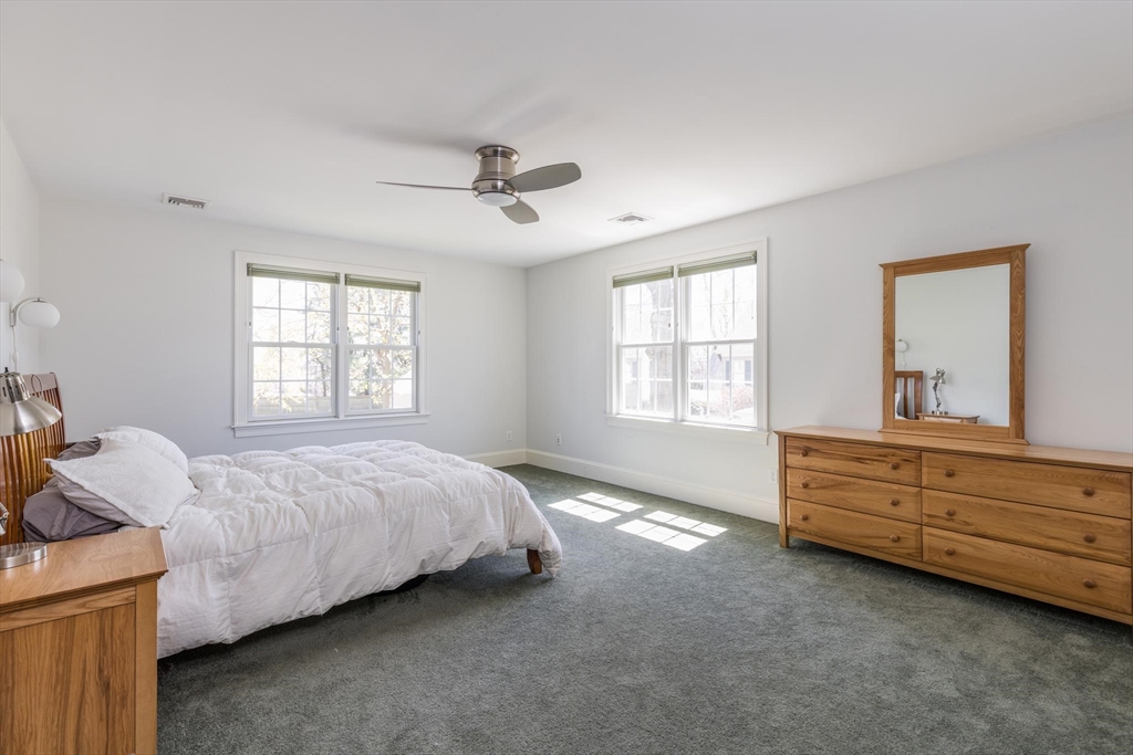 38 Maple Street, Unit 38 Needham, MA 02492 - Photo 5 of 14 a bed room with a bed and a window