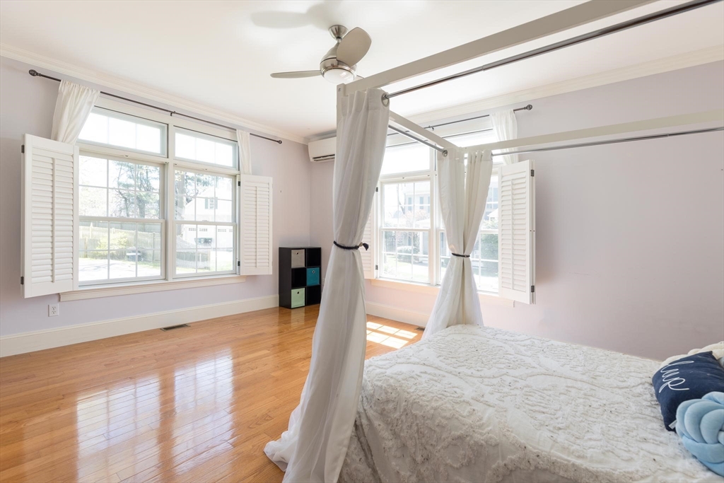 38 Maple Street, Unit 38 Needham, MA 02492 - Photo 6 of 14 a spacious bedroom with a large bed and a large window