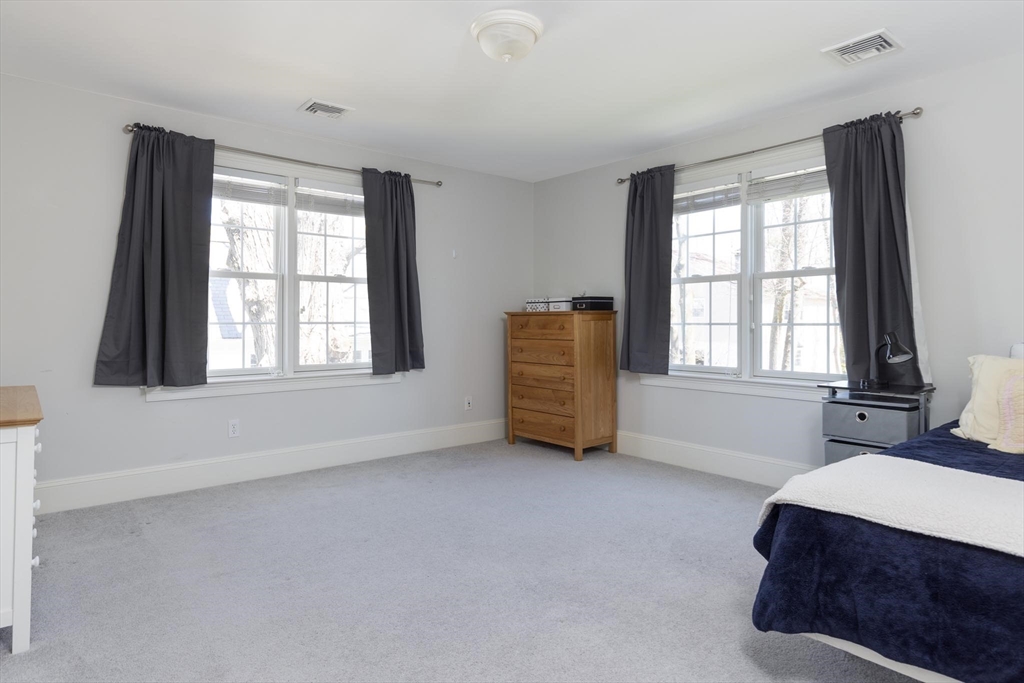 38 Maple Street, Unit 38 Needham, MA 02492 - Photo 8 of 14 a living room with furniture and a window
