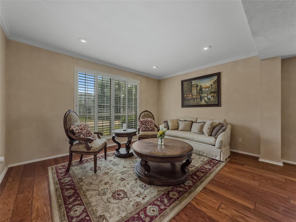 2317 Wellesly Road Rowlett, TX 75089 - Photo 9 of 39 a living room with furniture a rug and a window