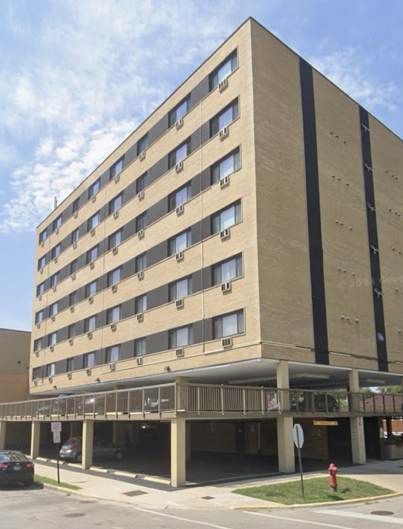 7300 West North Avenue, Unit 1A Elmwood Park, IL 60707 - Photo 1 of 15 a front view of a building with street