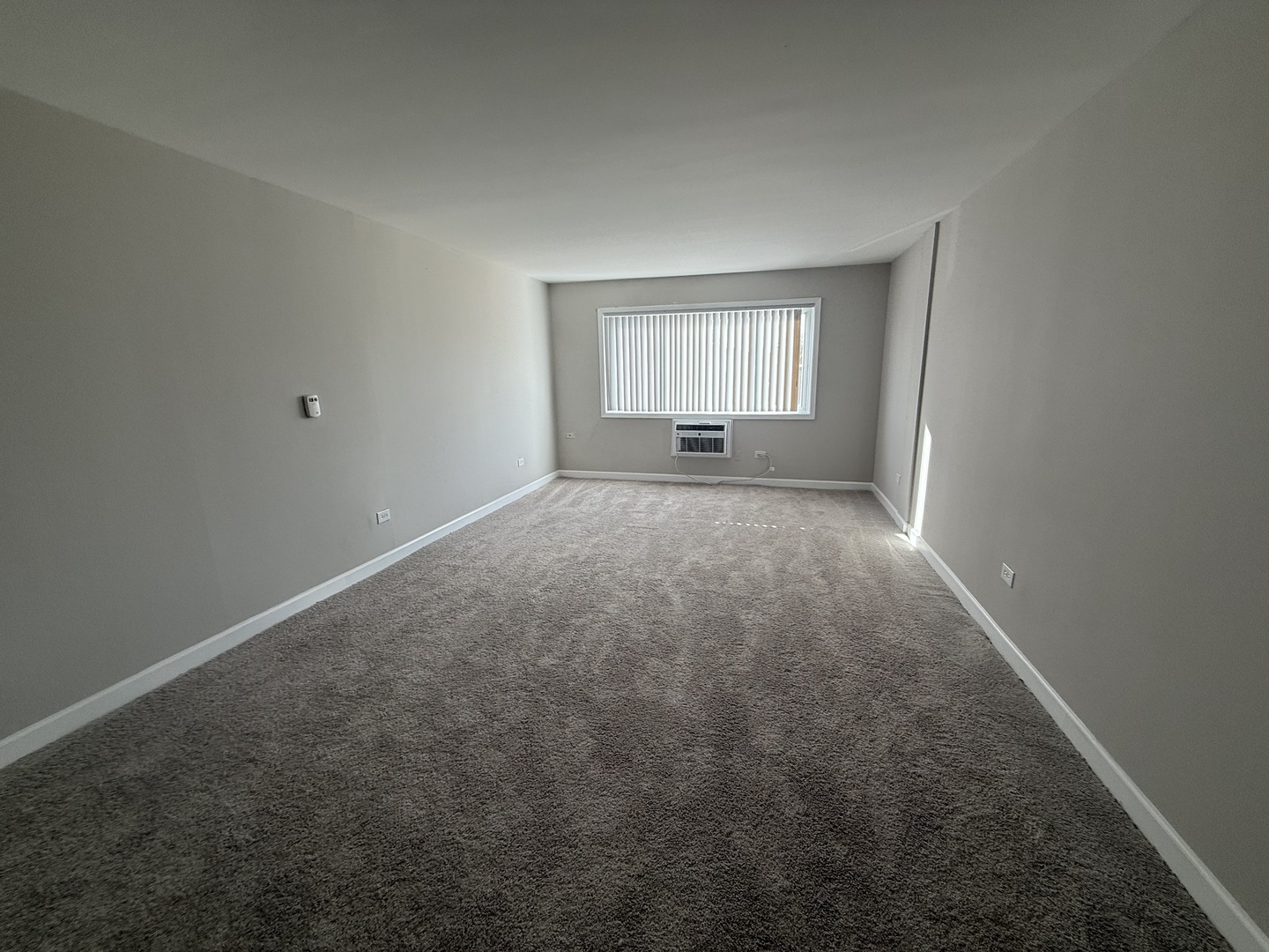 7300 West North Avenue, Unit 1A Elmwood Park, IL 60707 - Photo 11 of 15 an empty room with a window