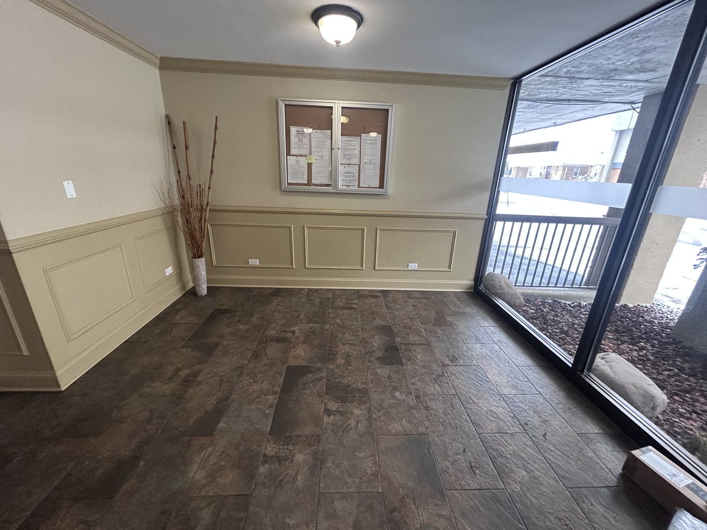 7300 West North Avenue, Unit 1A Elmwood Park, IL 60707 - Photo 4 of 15 an empty room with wooden floor and windows