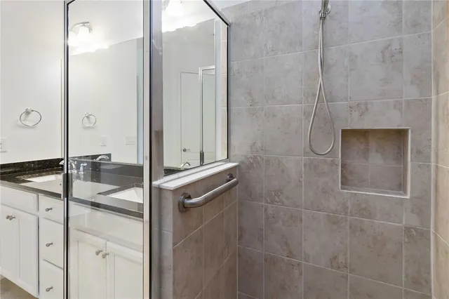 a bathroom with a shower and a sink