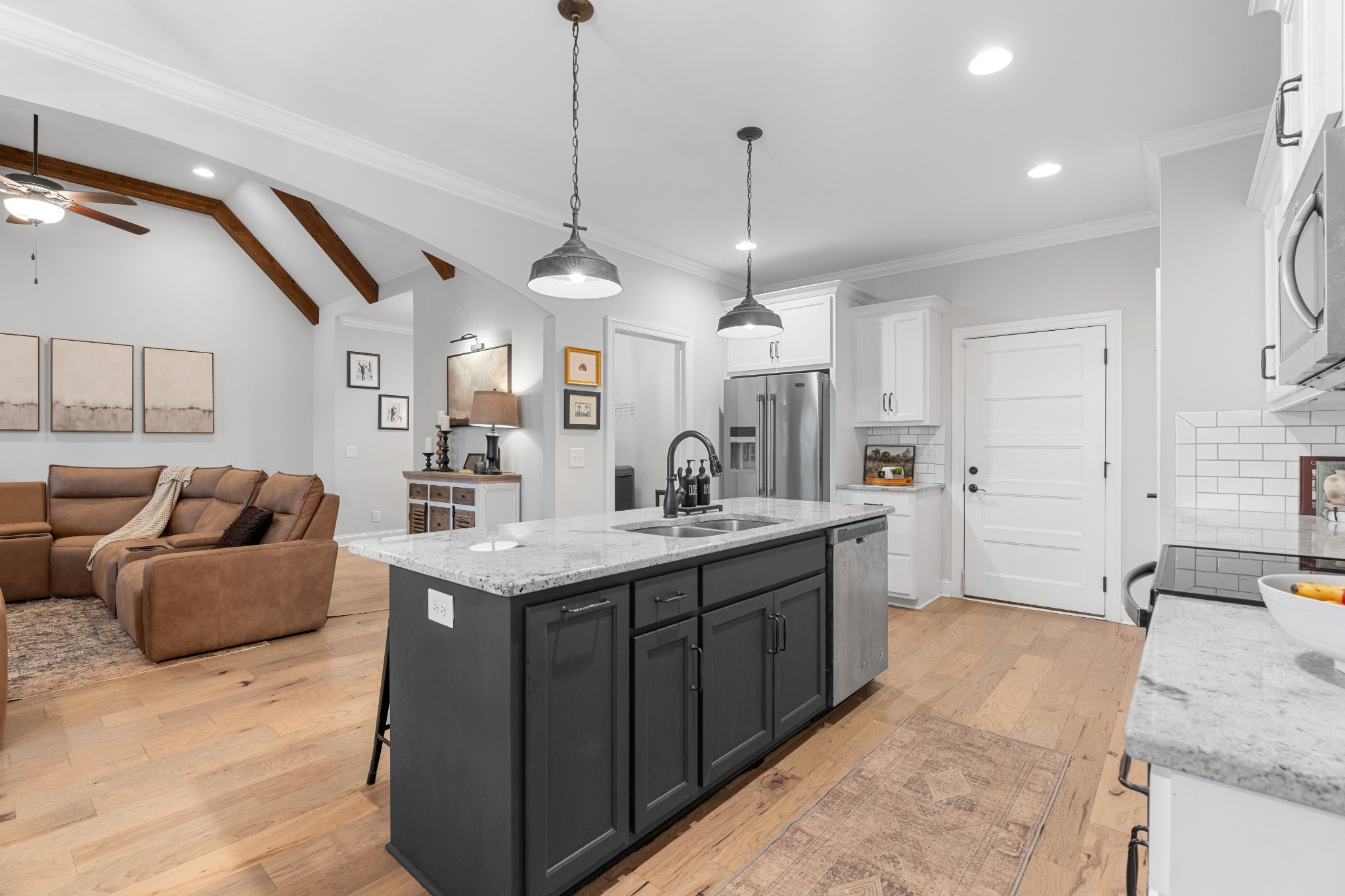 111 Flat Woods Road Lebanon, TN 37090 - Photo 14 of 60 a large kitchen with stainless steel appliances kitchen island granite countertop a sink a stove and a granite counter top
