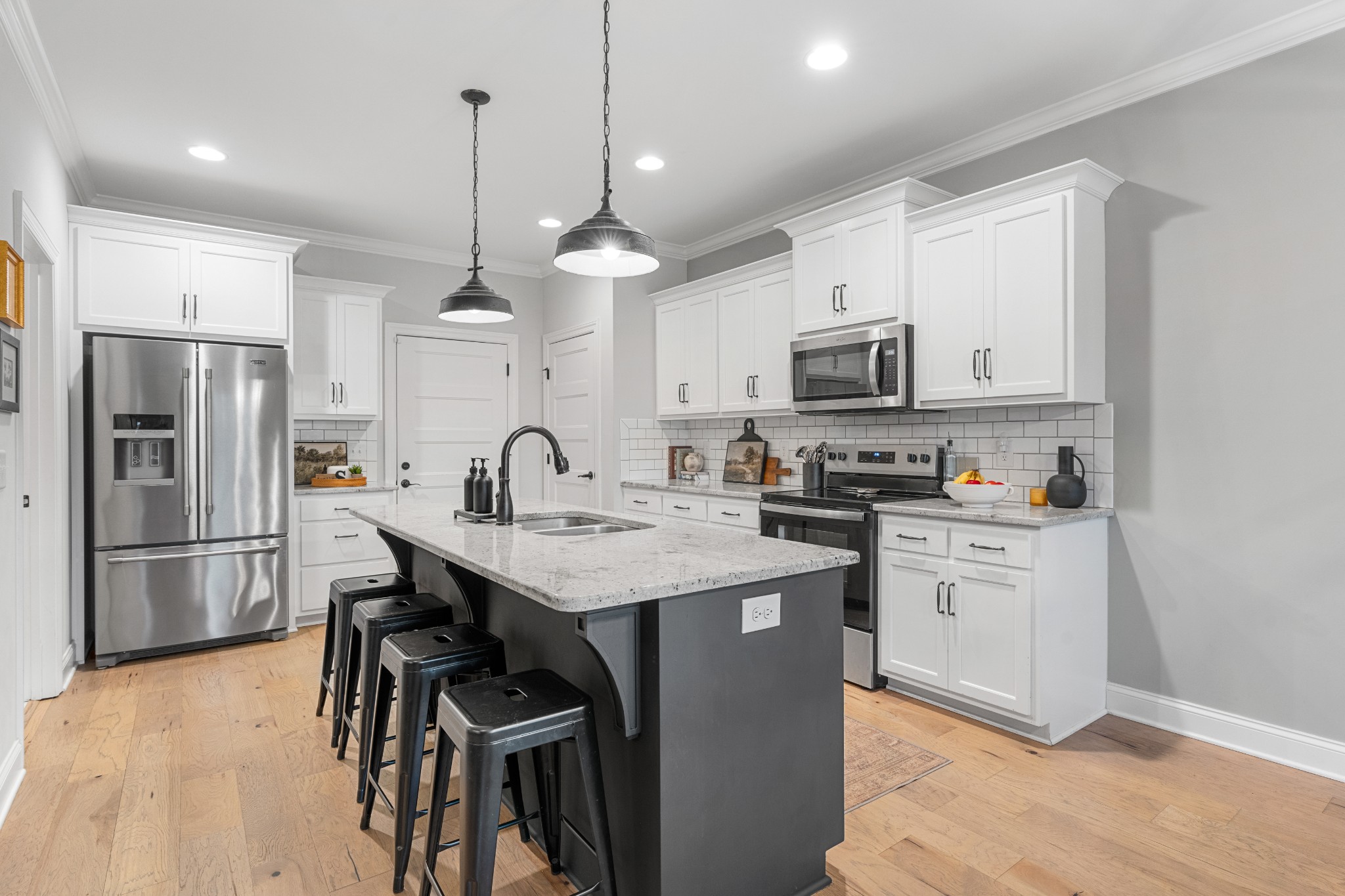 111 Flat Woods Road Lebanon, TN 37090 - Photo 16 of 60 a kitchen with a sink stainless steel appliances and white cabinets