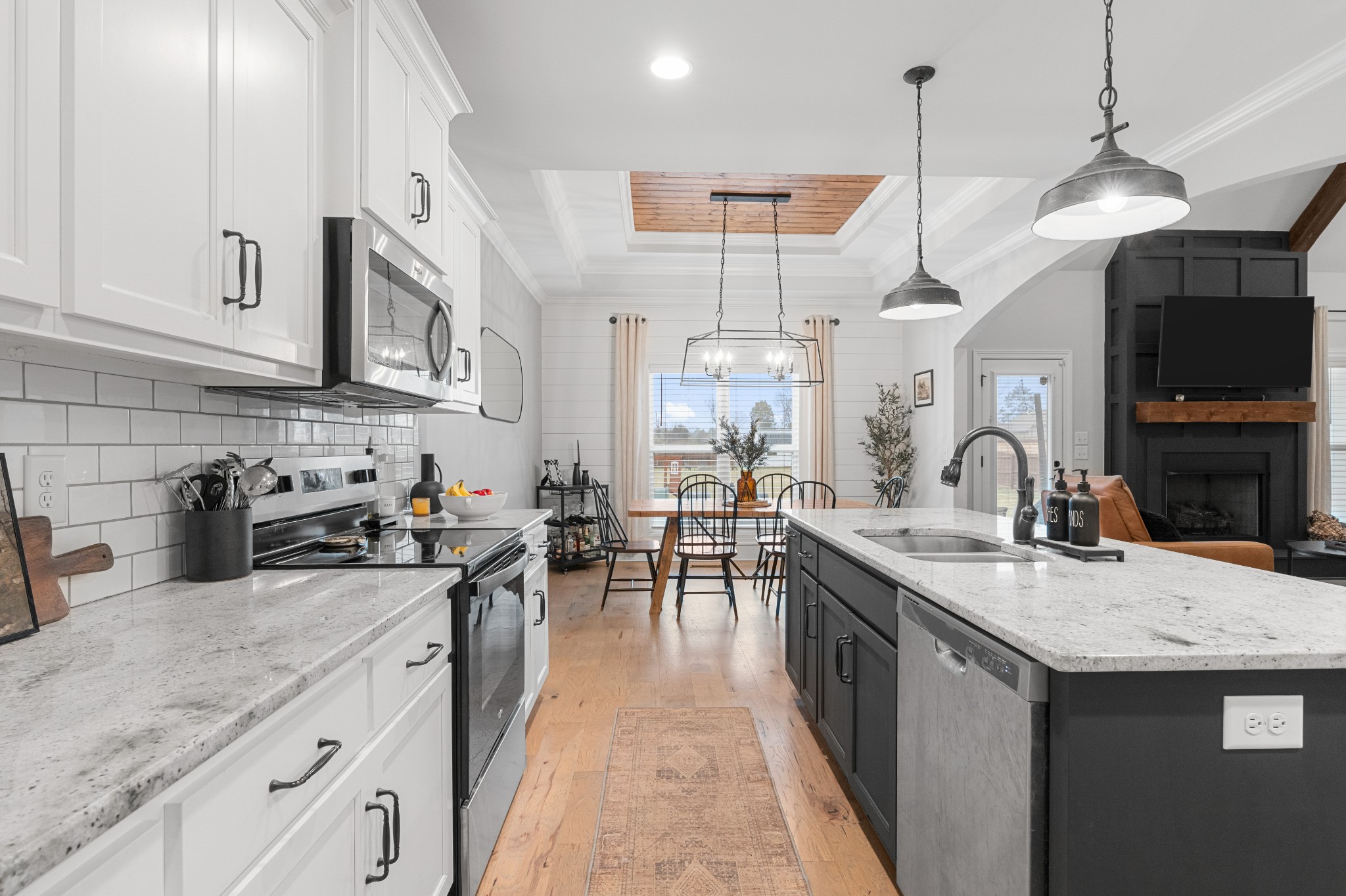 111 Flat Woods Road Lebanon, TN 37090 - Photo 20 of 60 a kitchen with stainless steel appliances granite countertop a sink a stove and a wooden floors