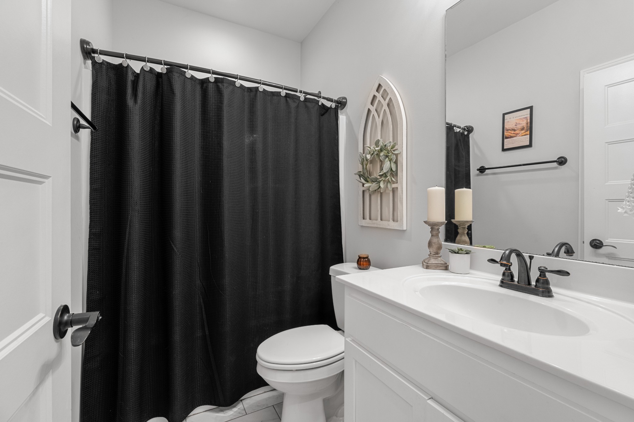 111 Flat Woods Road Lebanon, TN 37090 - Photo 37 of 60 a bathroom with a sink a toilet a mirror and shower curtain