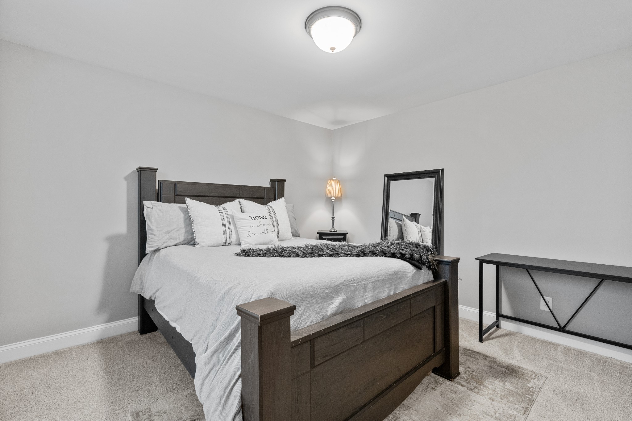 111 Flat Woods Road Lebanon, TN 37090 - Photo 47 of 60 a bed sitting in a bedroom next to a window