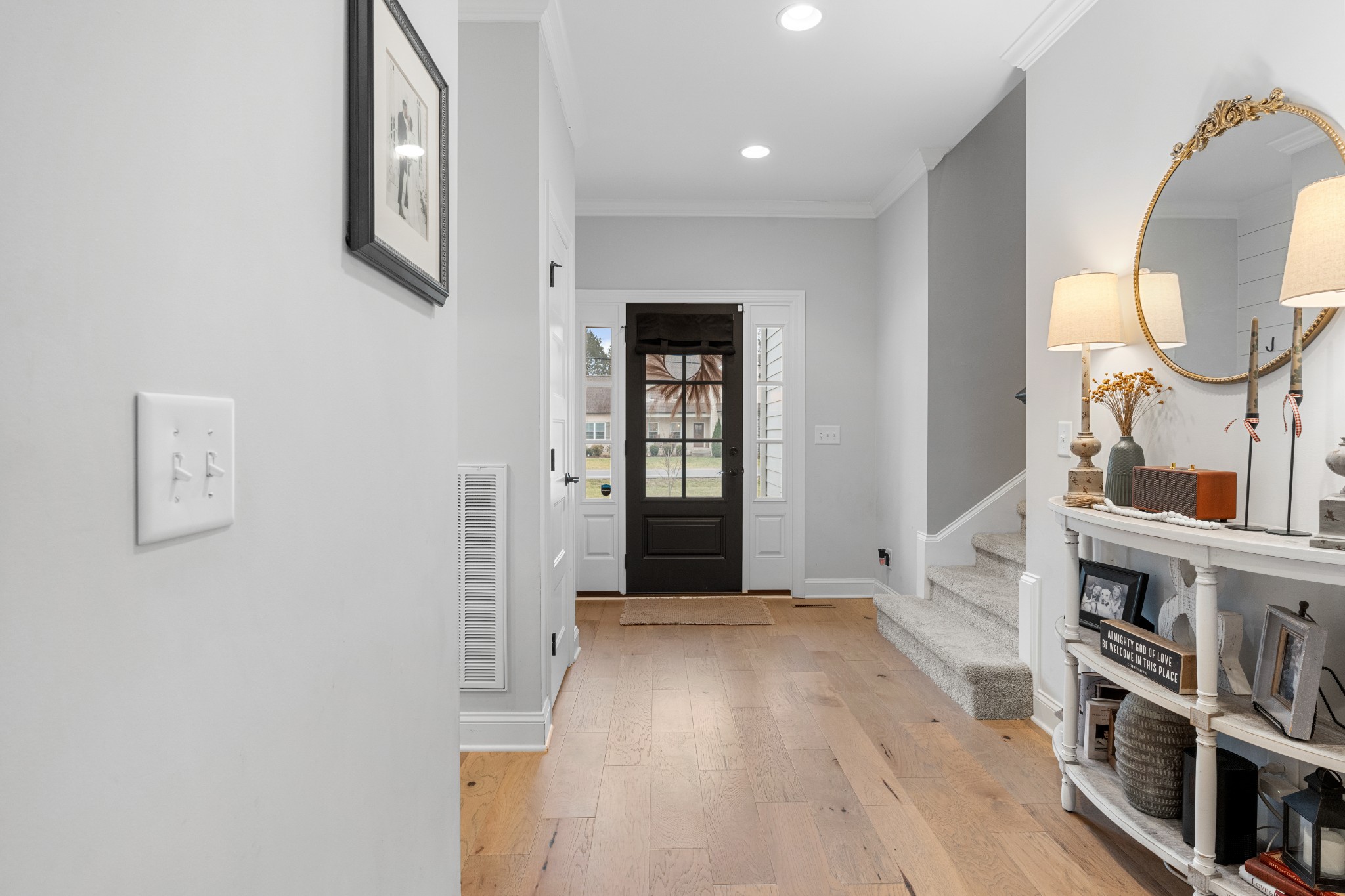 111 Flat Woods Road Lebanon, TN 37090 - Photo 5 of 60 an entryway and a livingroom with wooden floor