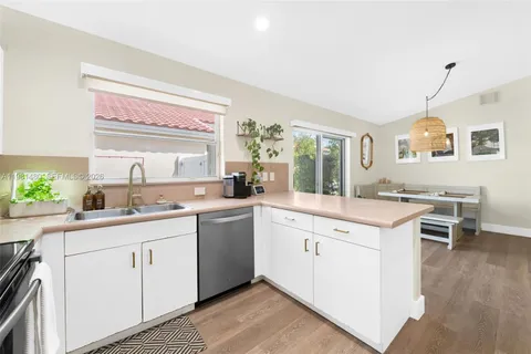 a kitchen with a sink and cabinets