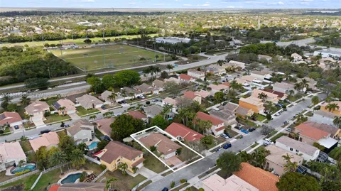 an aerial view of residential houses with outdoor space