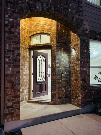 a front view of a house with a glass door