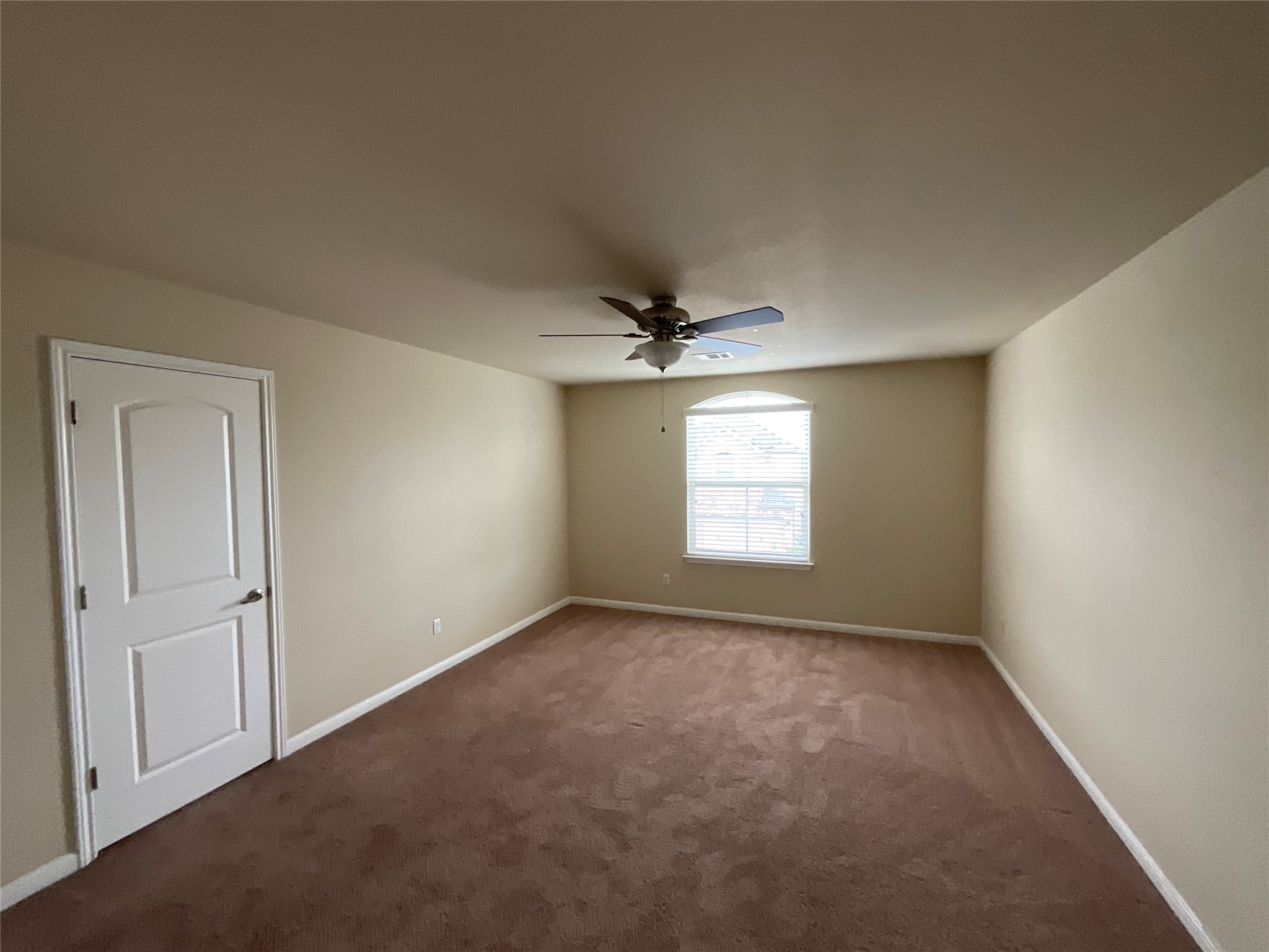 3451 Mayfield Ranch Boulevard, Unit 311 Round Rock, TX 78681 - Photo 25 of 29 Unfurnished room with dark colored carpet and a ceiling fan