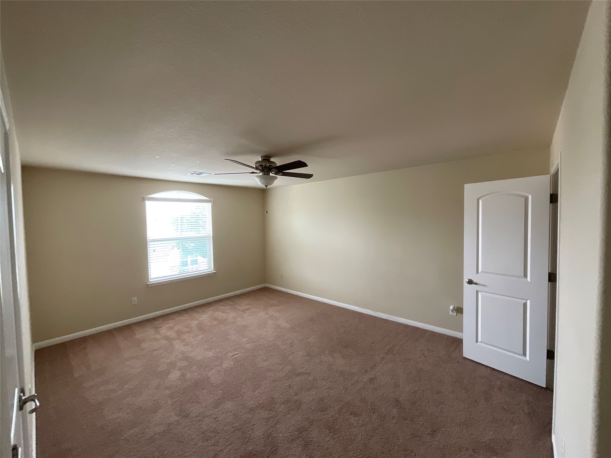 3451 Mayfield Ranch Boulevard, Unit 311 Round Rock, TX 78681 - Photo 26 of 29 Spare room with dark colored carpet and a ceiling fan