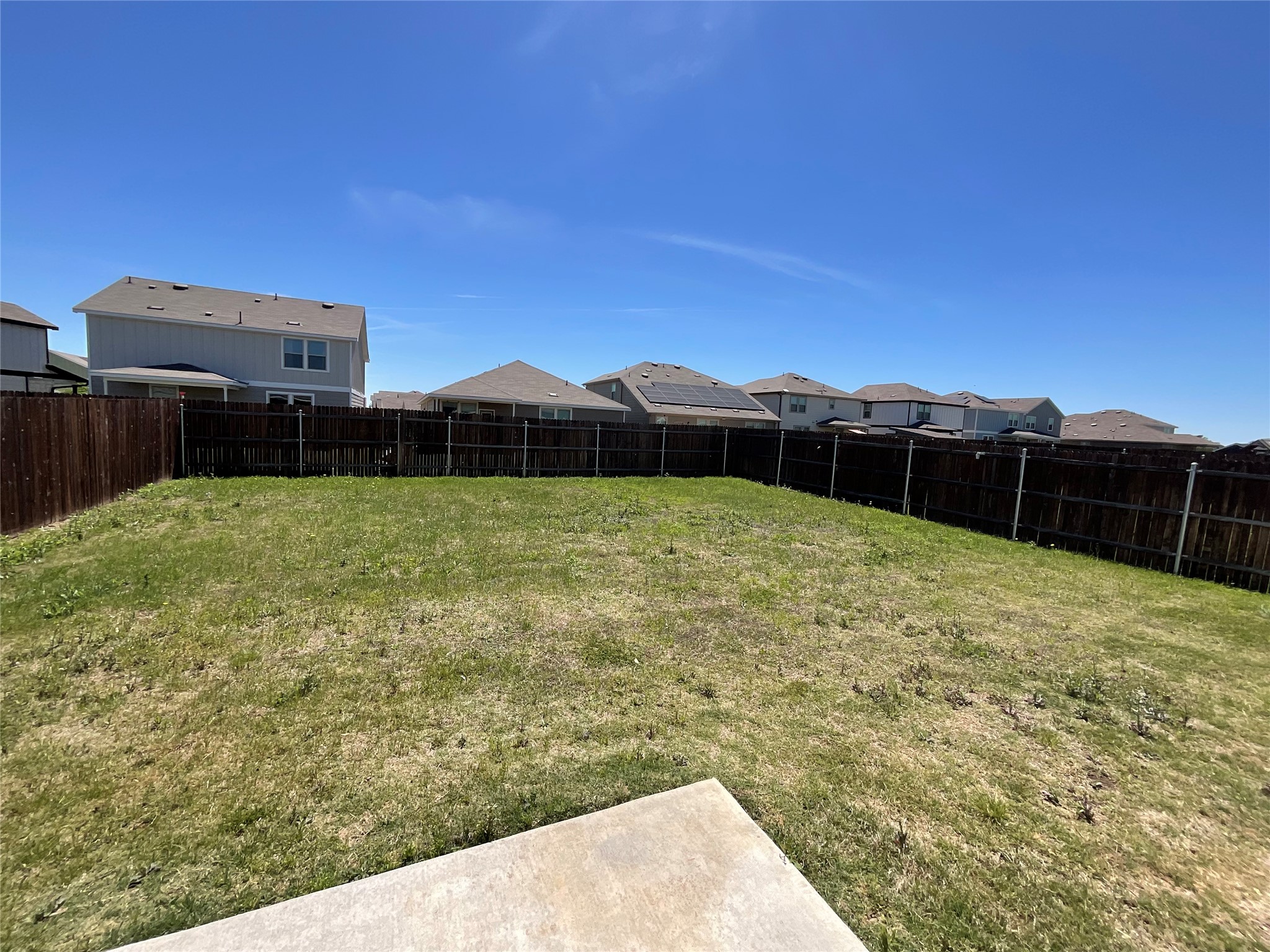 3451 Mayfield Ranch Boulevard, Unit 311 Round Rock, TX 78681 - Photo 28 of 29 Fenced backyard with a residential view