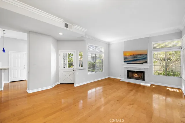 a view of a livingroom with an empty space and a fireplace
