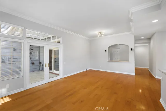 a view of a big room with windows and entryway