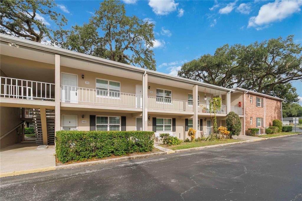 2500 Lee Road, Unit 244 Winter Park, FL 32789 - Photo 3 of 26 a front view of a building with garden