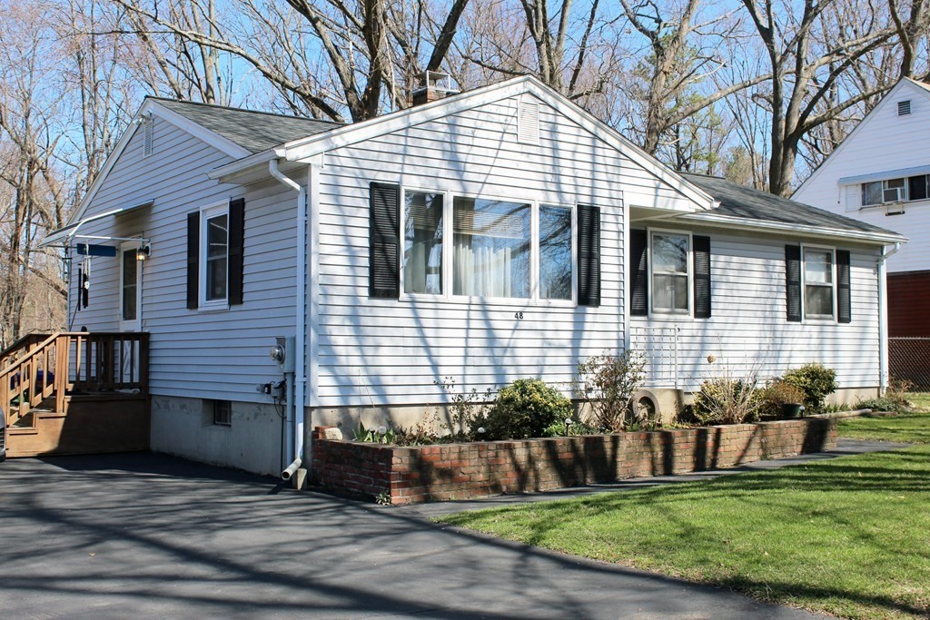 48 Bexhill Street Springfield, MA 01119 - Photo 1 of 14 a front view of a house with a yard