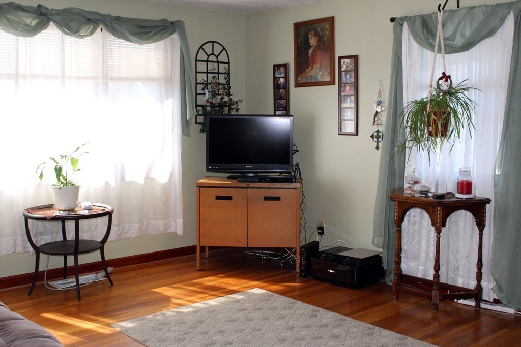 48 Bexhill Street Springfield, MA 01119 - Photo 6 of 14 a living room with furniture and a flat screen tv