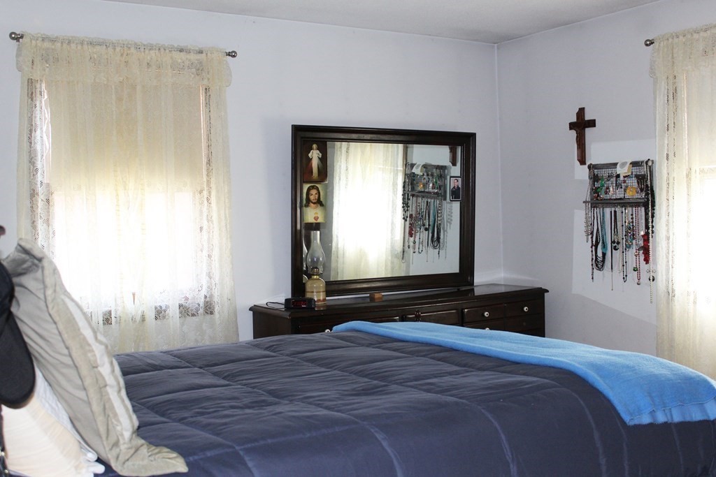 48 Bexhill Street Springfield, MA 01119 - Photo 7 of 14 a bedroom with a bed and a window