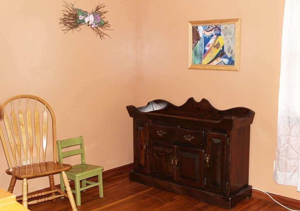 48 Bexhill Street Springfield, MA 01119 - Photo 9 of 14 a view of a workspace with furniture and a potted plant