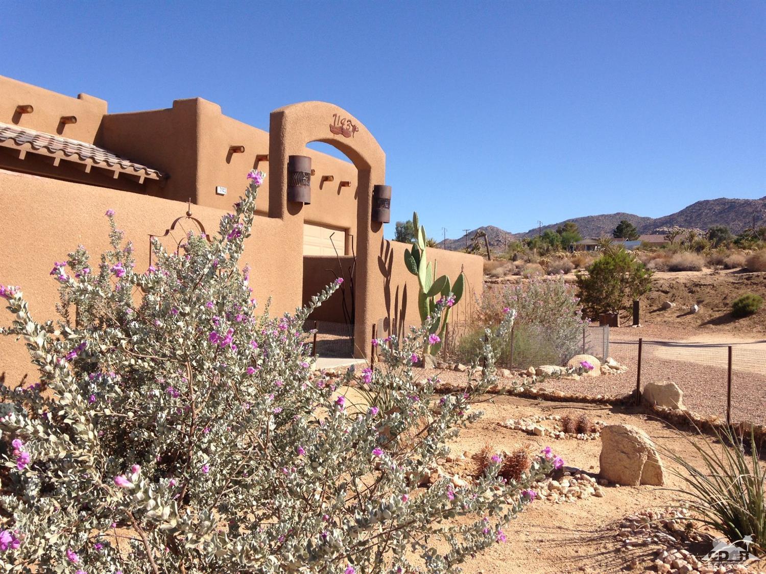 7143 Juniper Road Joshua Tree, CA 92252 - Photo 1 of 24 a view of a house with a yard