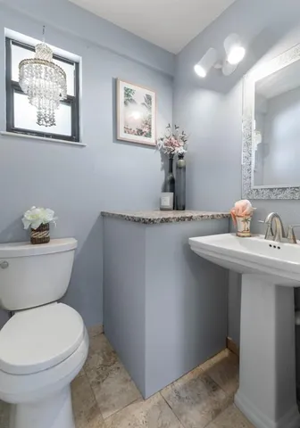 an aerial view of a house with a lake view