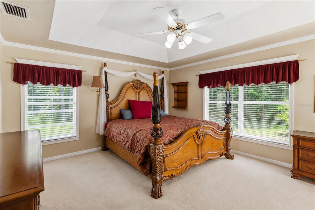 3225 Canoe Creek Road St. Cloud, FL 34772 - Photo 21 of 30 a bed sitting in a room next to a window