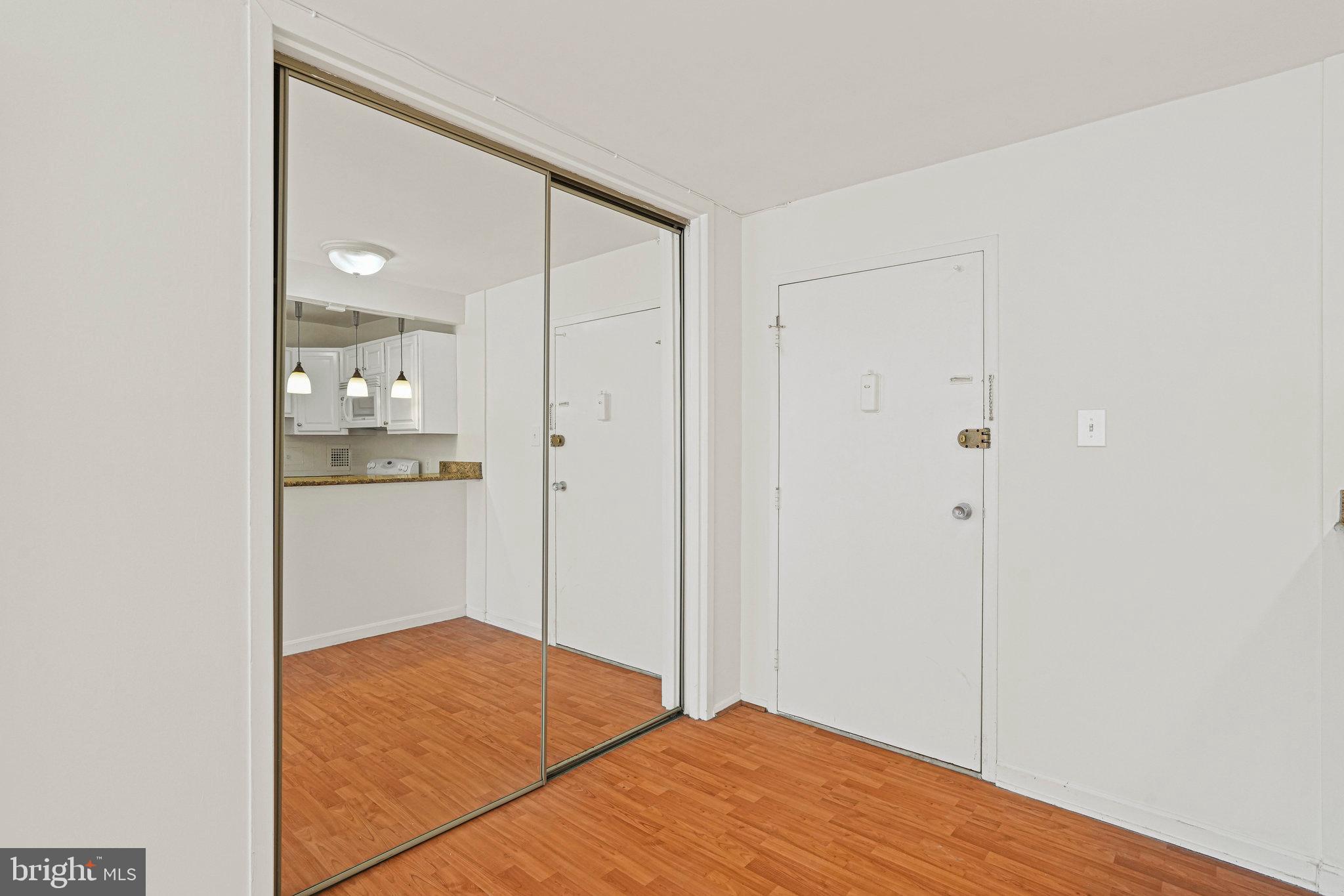 2401 H Street Northwest, Unit 202 Washington, DC 20037 - Photo 4 of 23 a bedroom with a bed and bathroom