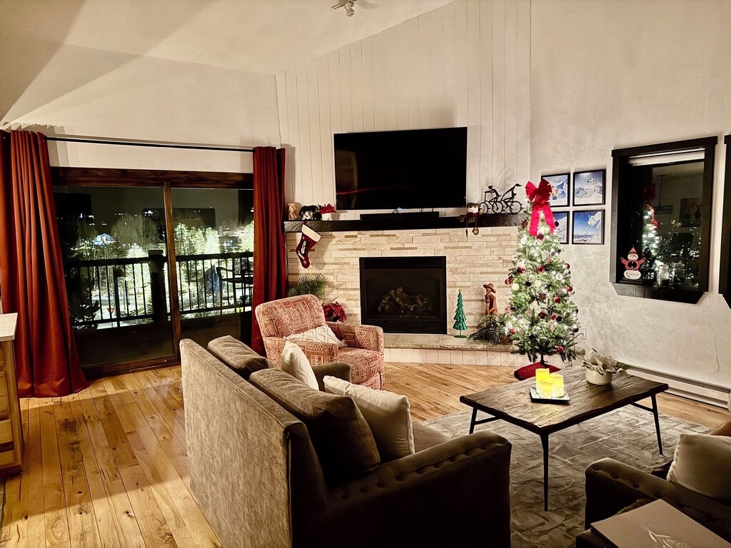 325 Four Oclock Road, Unit A301 Breckenridge, CO 80424 - Photo 7 of 41 Living area with Winter view lights