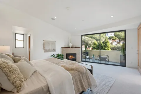 a bathroom with a granite countertop sink a mirror and a shower