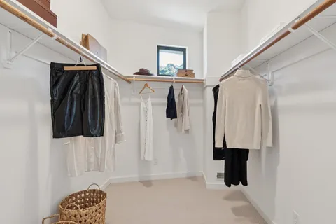 a bathroom with a double vanity sink and mirror