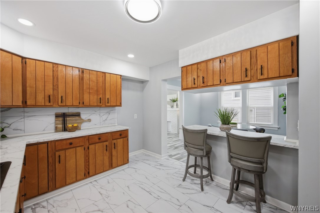 216 Sanders Road Buffalo, NY 14216 - Photo 13 of 34 OPEN COUNTER TO DINING ROOM W/ STOOLS