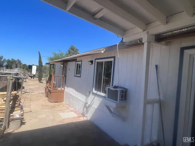 a backyard of a house with seating space