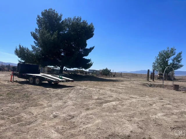 a view of a lake with a car parked in the background