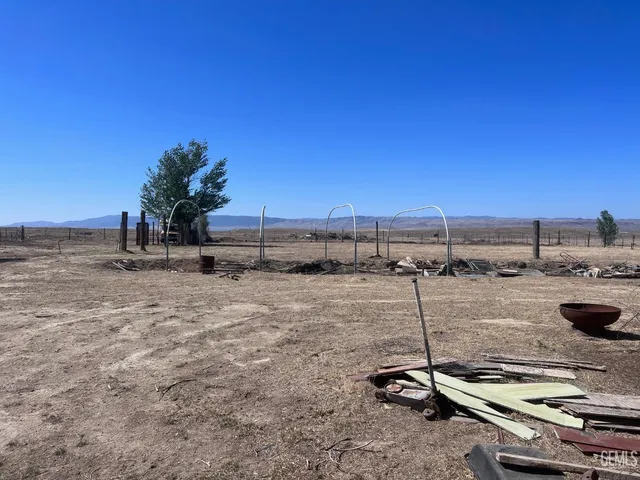 a view of a swimming pool with a table and chairs